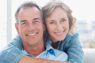 Couple smiling at dentist near me Denver CO