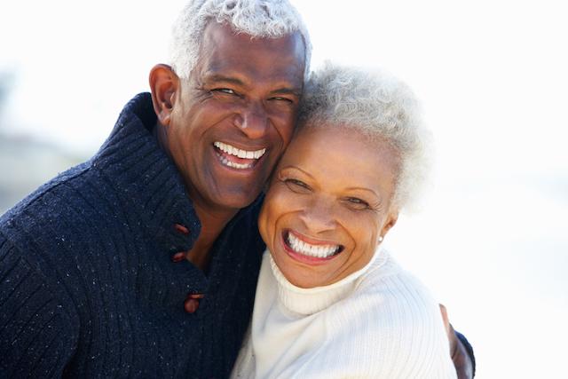 Man and wife smiling at Crestmoor Park in Denver