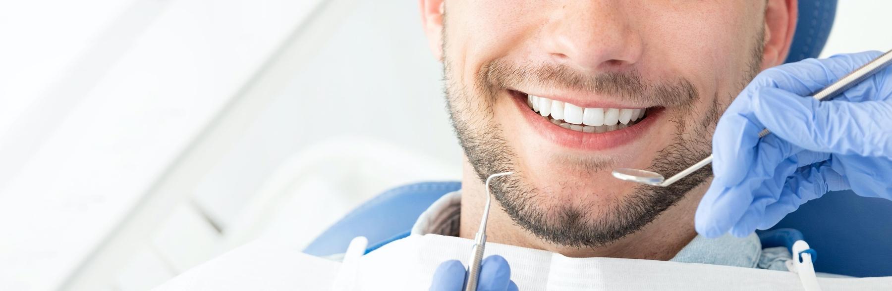 Patient at dental exam with MAGD dentist in Denver CO